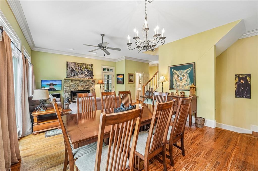 14 Laurel Ridge Lane Big Canoe, GA 30143 - Photo 16 of 72 a view of a dining room with furniture a chandelier and wooden floor