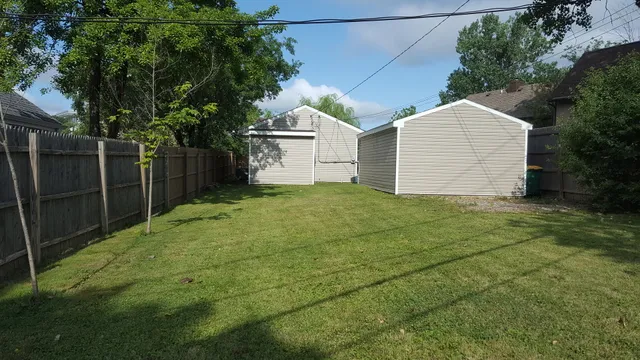 a backyard of a house with garage