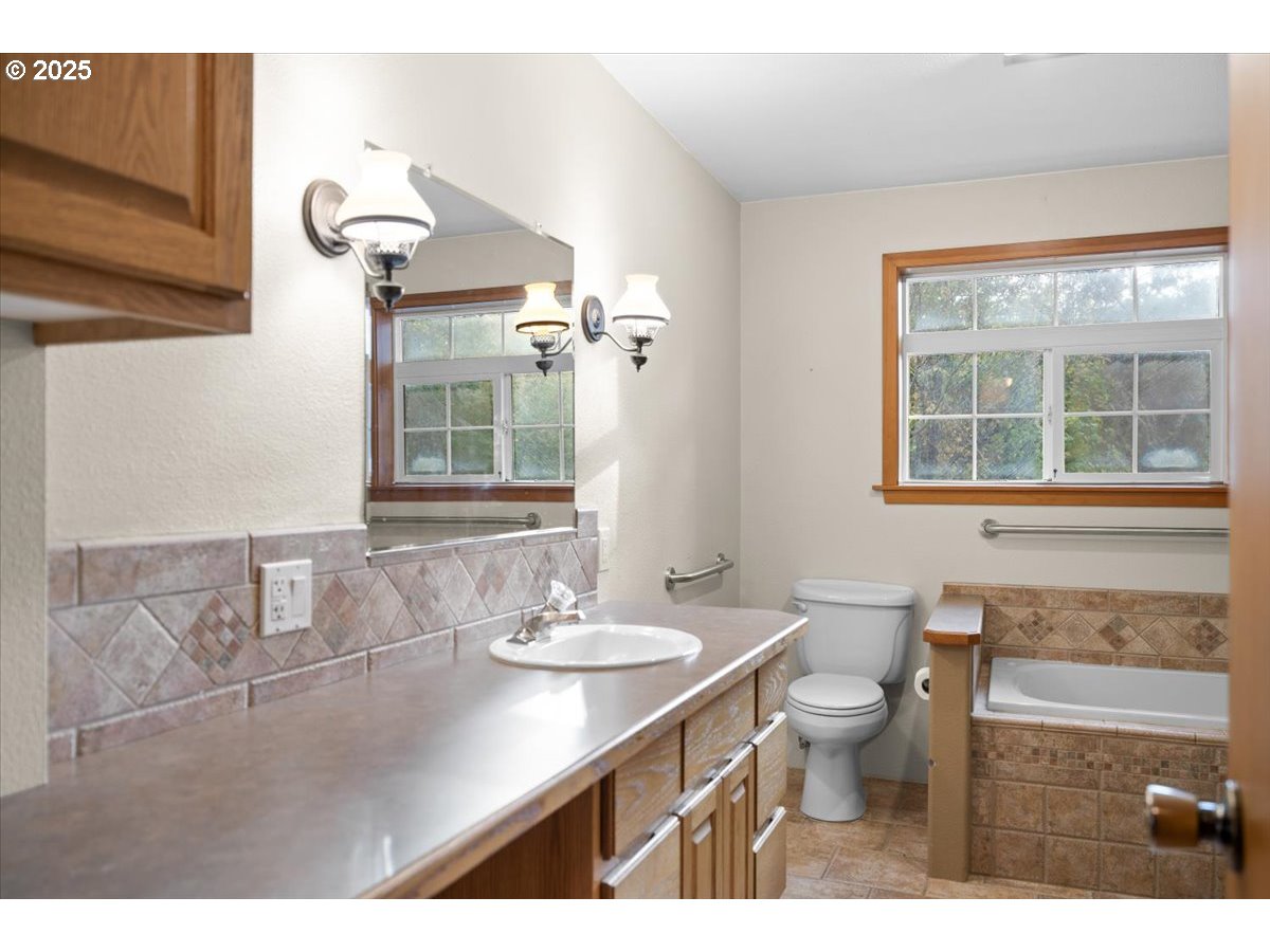 939 Buckhorn Road Roseburg, OR 97470 - Photo 14 of 35 a bathroom with a sink and a mirror