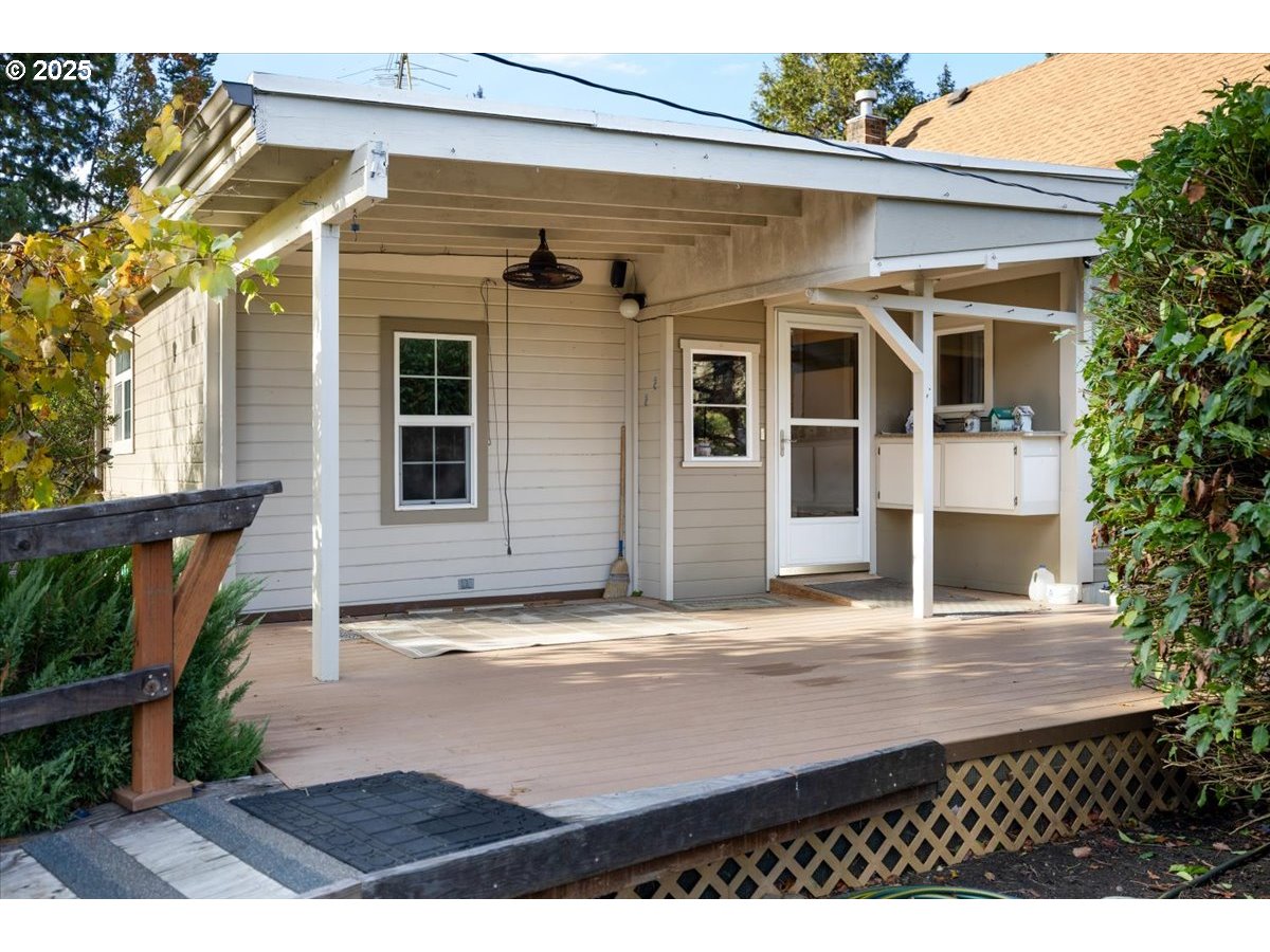939 Buckhorn Road Roseburg, OR 97470 - Photo 19 of 35 a view of a house with a door and wooden bench