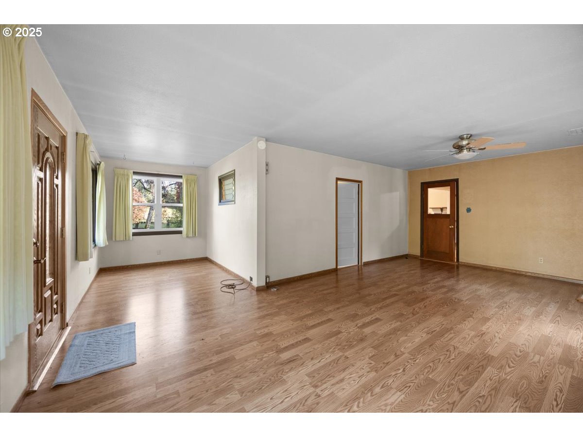 939 Buckhorn Road Roseburg, OR 97470 - Photo 4 of 35 a view of an empty room and window