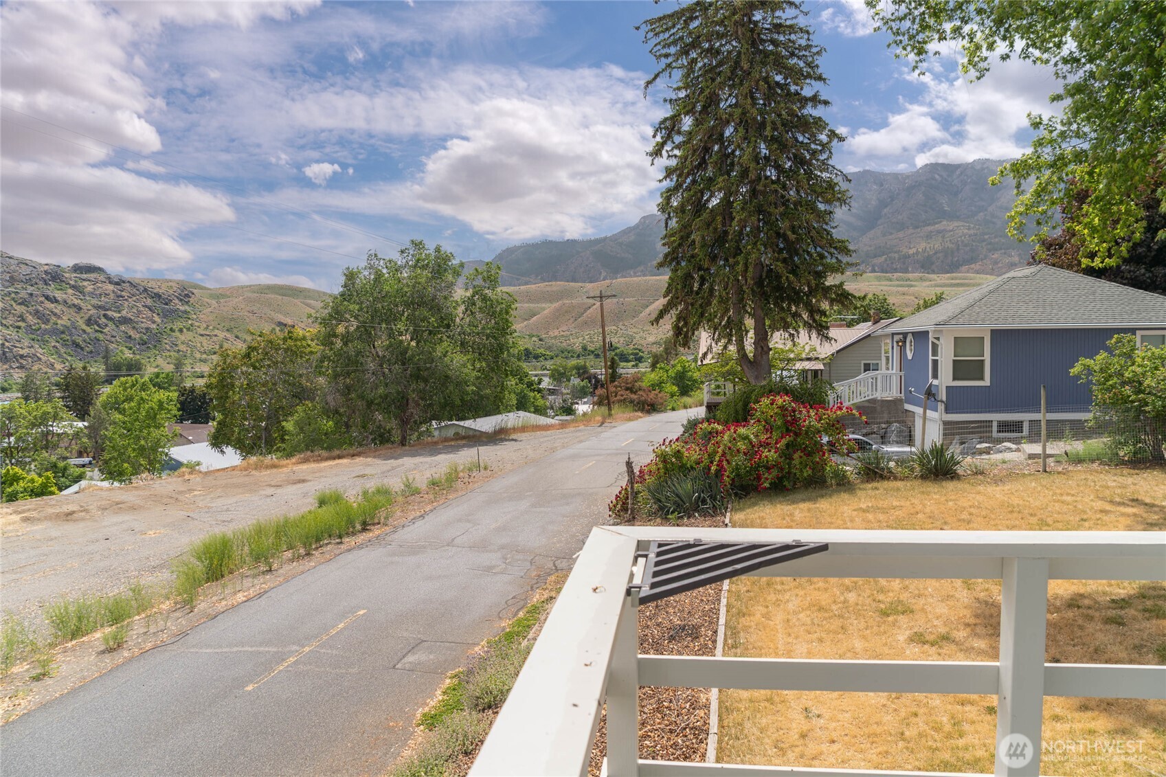 462 Beach Street Pateros, WA 98846 - Photo 12 of 30 a front view of a house with a yard and garage