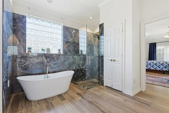 a bedroom with a large bed and a couch