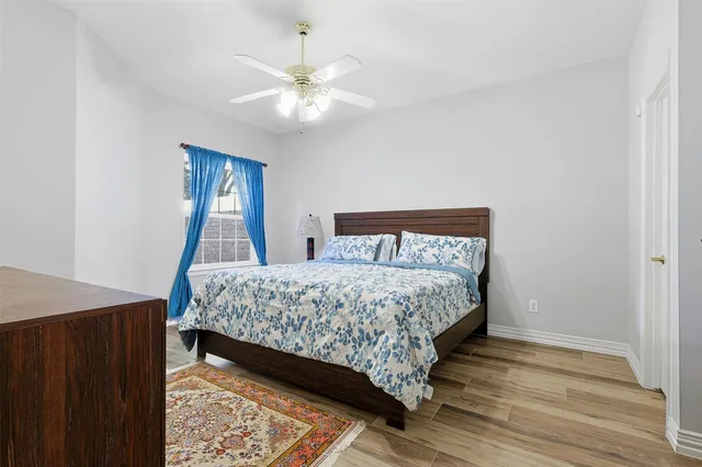 a bedroom with a bed and a dresser