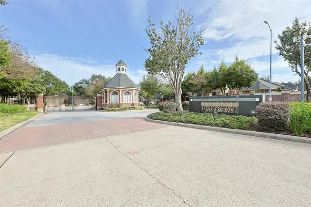 a view of backyard of house with outdoor seating