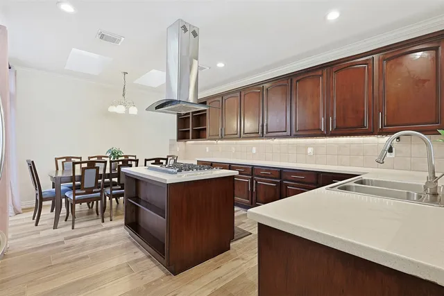 a view of a workspace with furniture and gym equipment