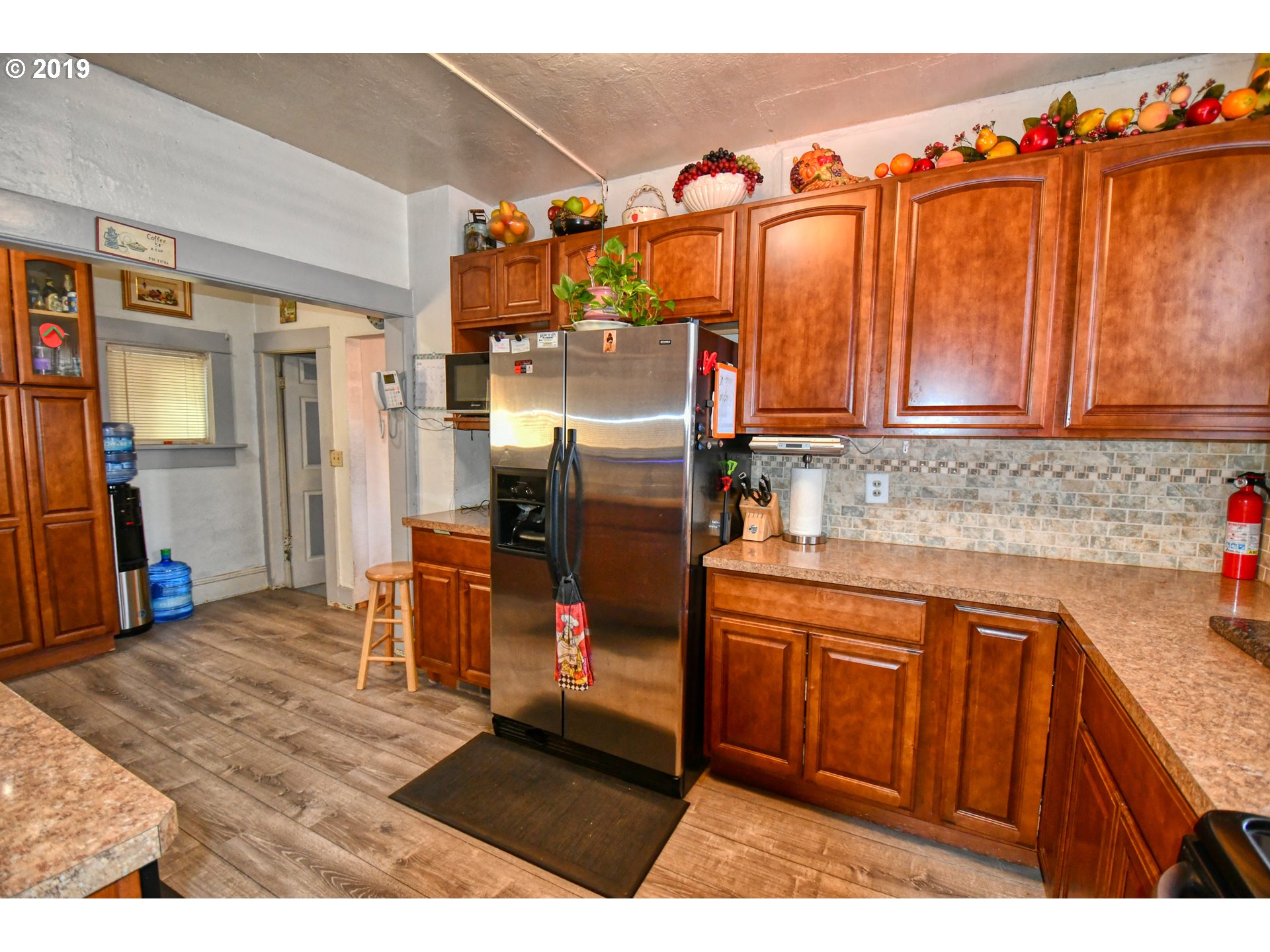 324 Southwest 2nd Street Pendleton, OR 97801 - Photo 12 of 32 a kitchen with stainless steel appliances granite countertop a refrigerator and a sink