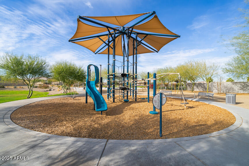 8875 West Colter Street Glendale, AZ 85305 - Photo 4 of 13 a view of a swimming pool with a table and chairs