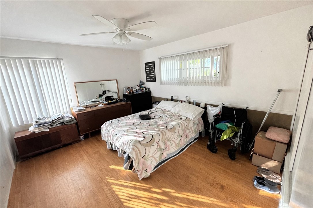 1625 Elevado Avenue Arcadia, CA 91006 - Photo 8 of 12 a bedroom with a bed and a chandelier