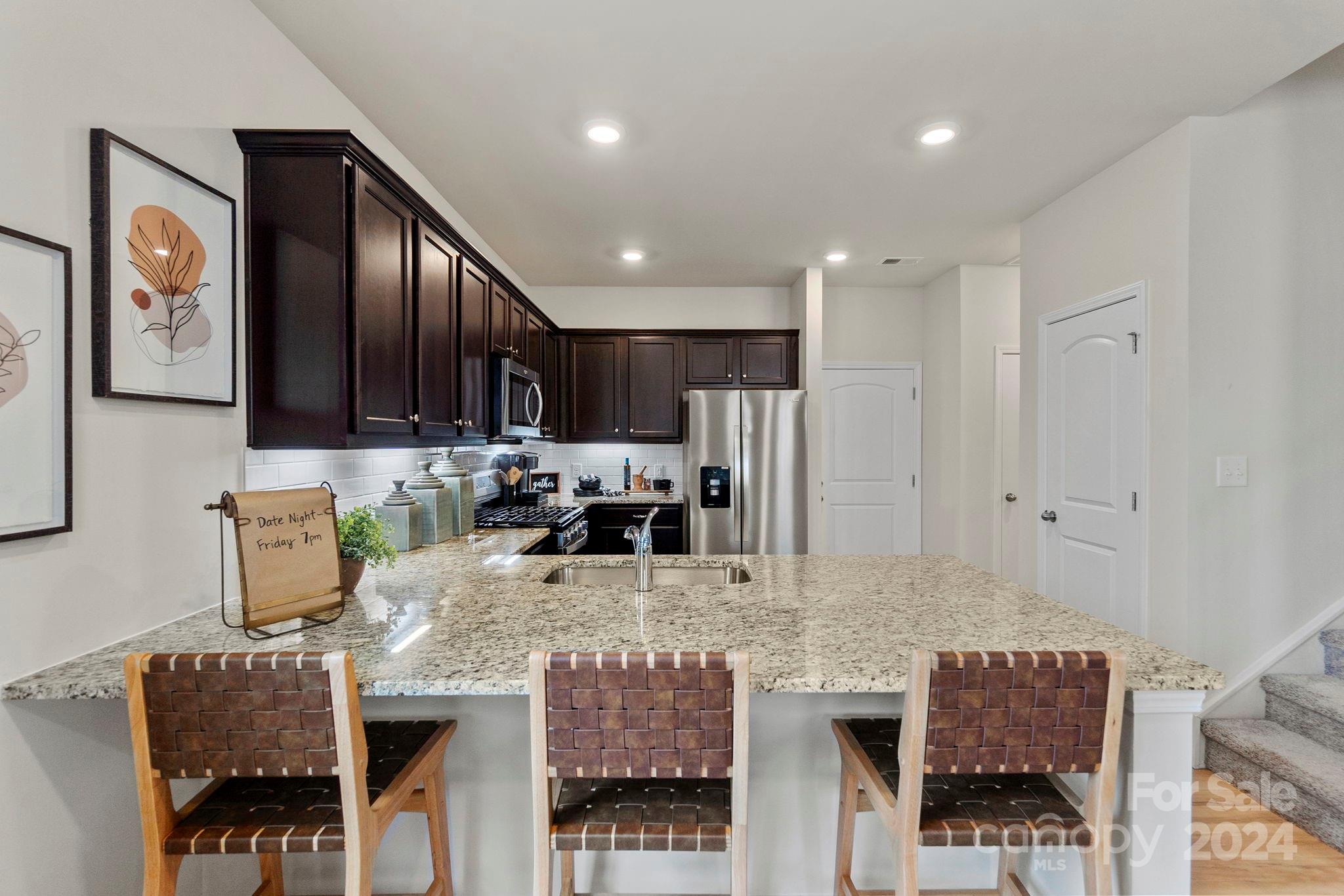 7906 Nelson Road Mint Hill, NC 28227 - Photo 7 of 29 a kitchen with granite countertop lots of counter top space