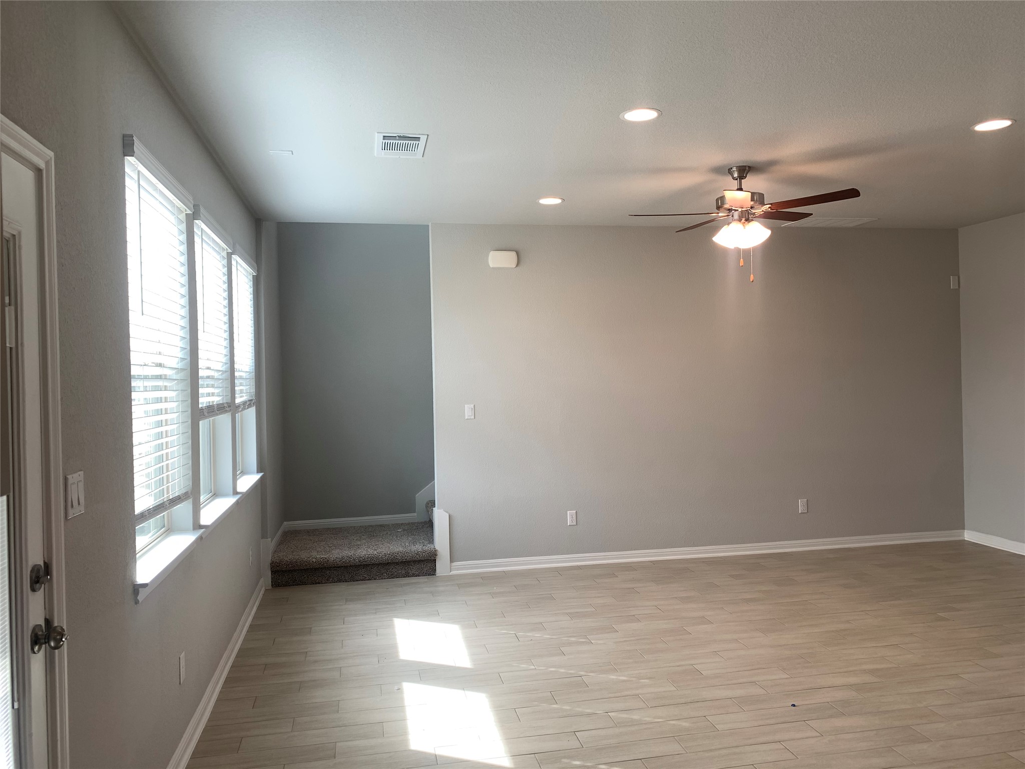 2948 Sage Ranch Drive Leander, TX 78641 - Photo 14 of 28 A spacious living area with abundant natural light and modern recessed lighting.