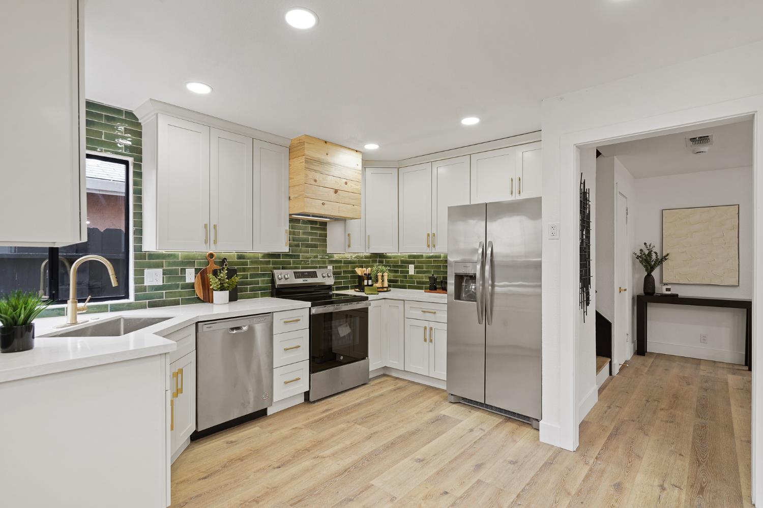 335 West Clover Road Tracy, CA 95376 - Photo 13 of 49 a kitchen with stainless steel appliances granite countertop a refrigerator and a sink