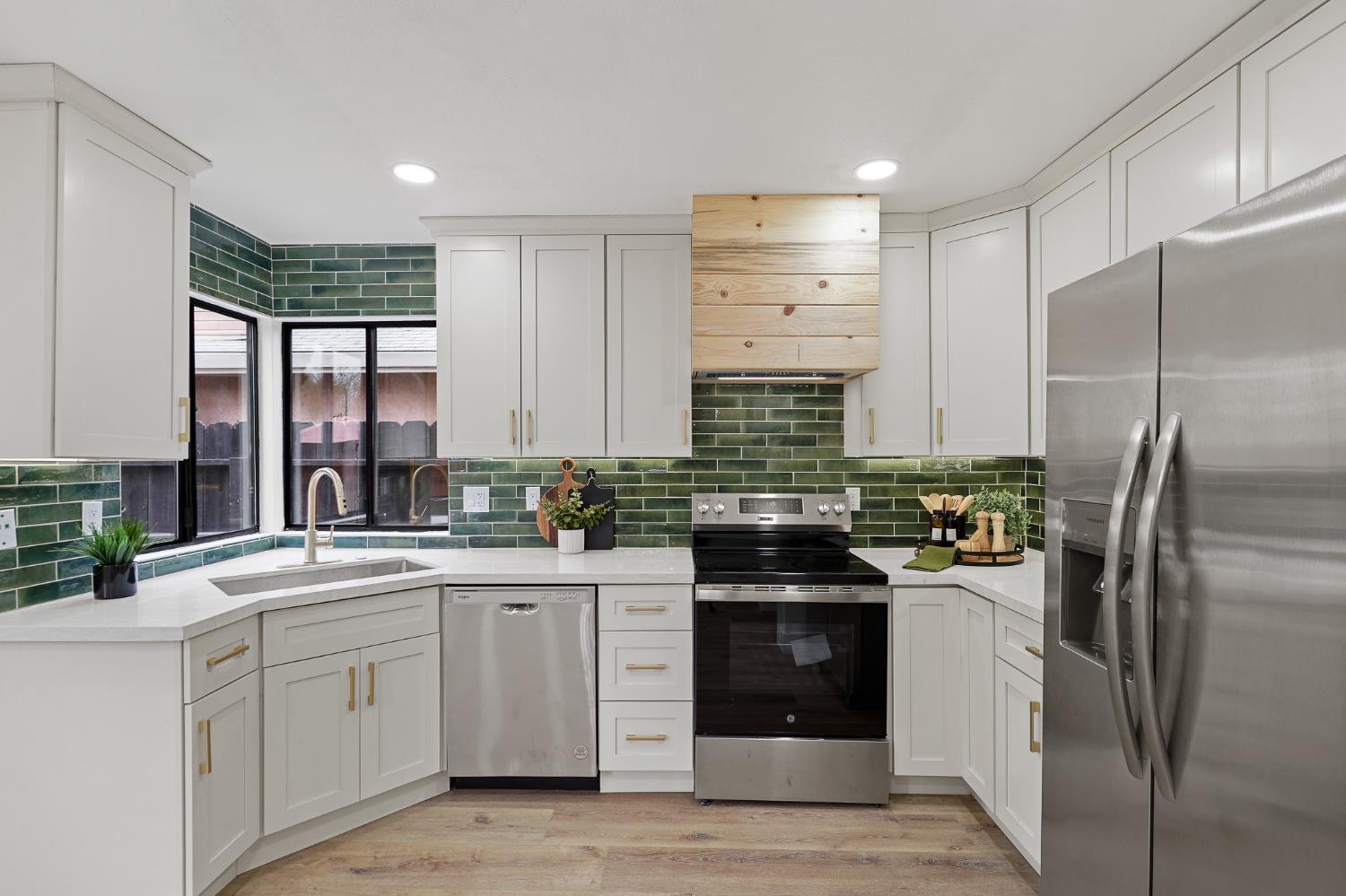 335 West Clover Road Tracy, CA 95376 - Photo 15 of 49 a kitchen with a sink stove and refrigerator
