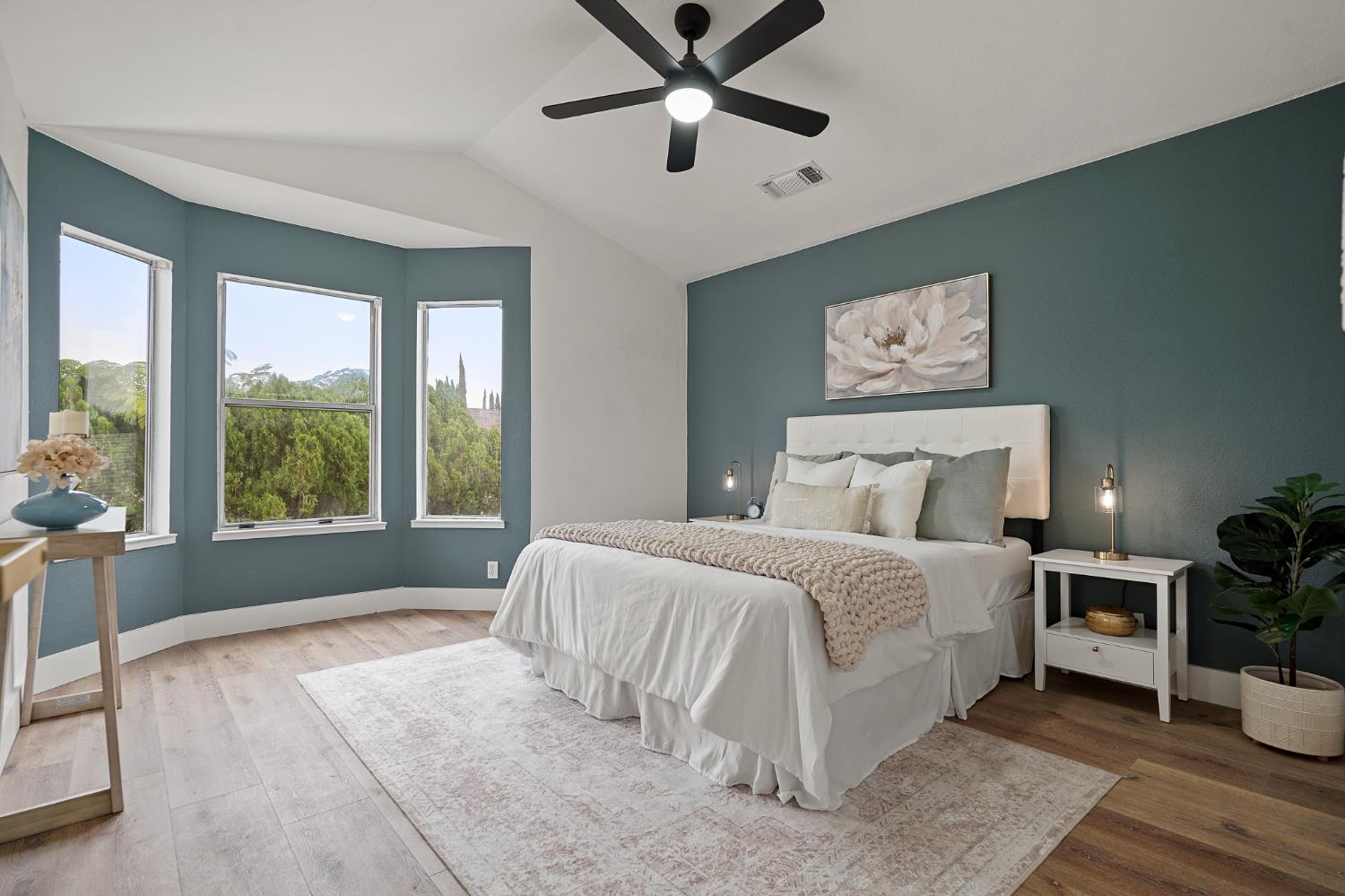 335 West Clover Road Tracy, CA 95376 - Photo 24 of 49 a bedroom with a large bed and a window