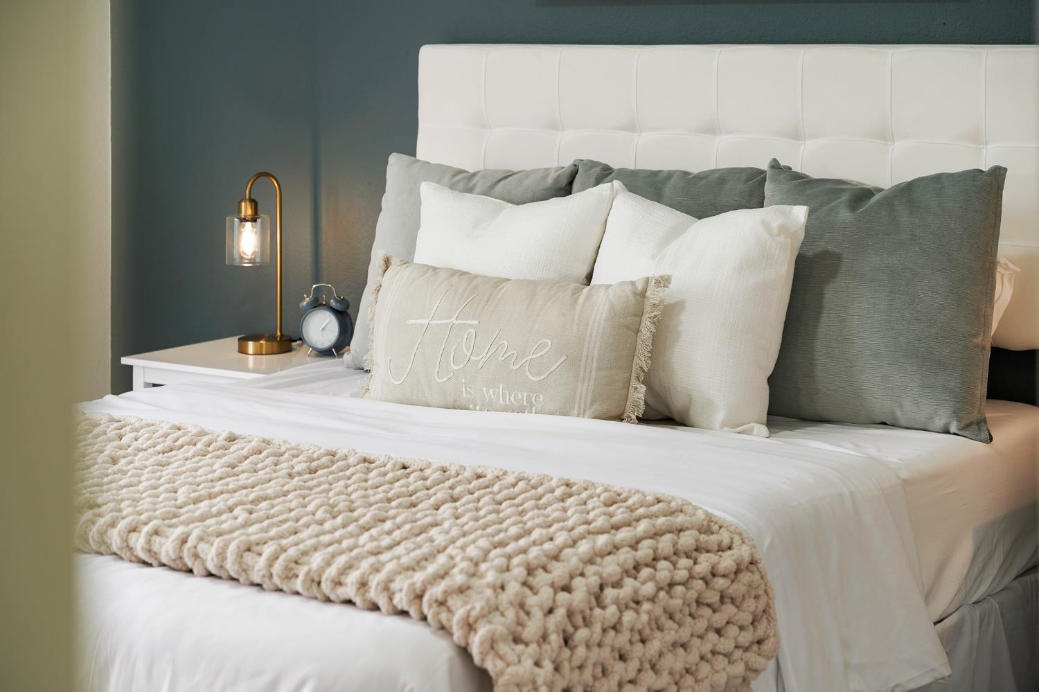 335 West Clover Road Tracy, CA 95376 - Photo 25 of 49 a bedroom with a bed and a lamp