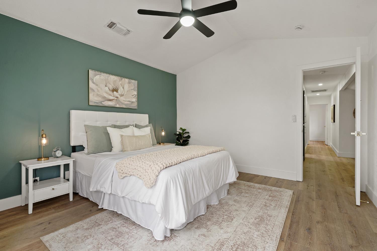 335 West Clover Road Tracy, CA 95376 - Photo 26 of 49 a bedroom with a bed and a painting on the wall