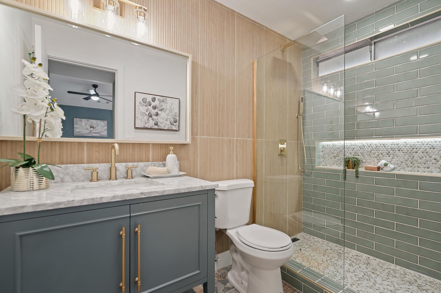 335 West Clover Road Tracy, CA 95376 - Photo 28 of 49 a bathroom with a granite countertop toilet sink and mirror