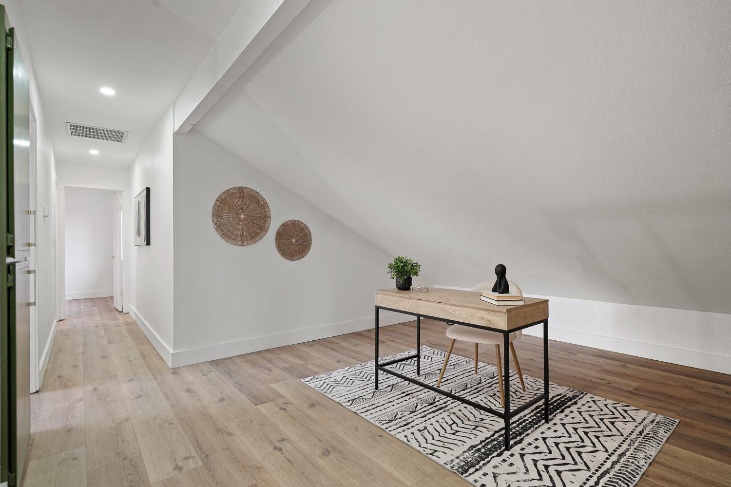 335 West Clover Road Tracy, CA 95376 - Photo 29 of 49 a workspace with furniture and wooden floor