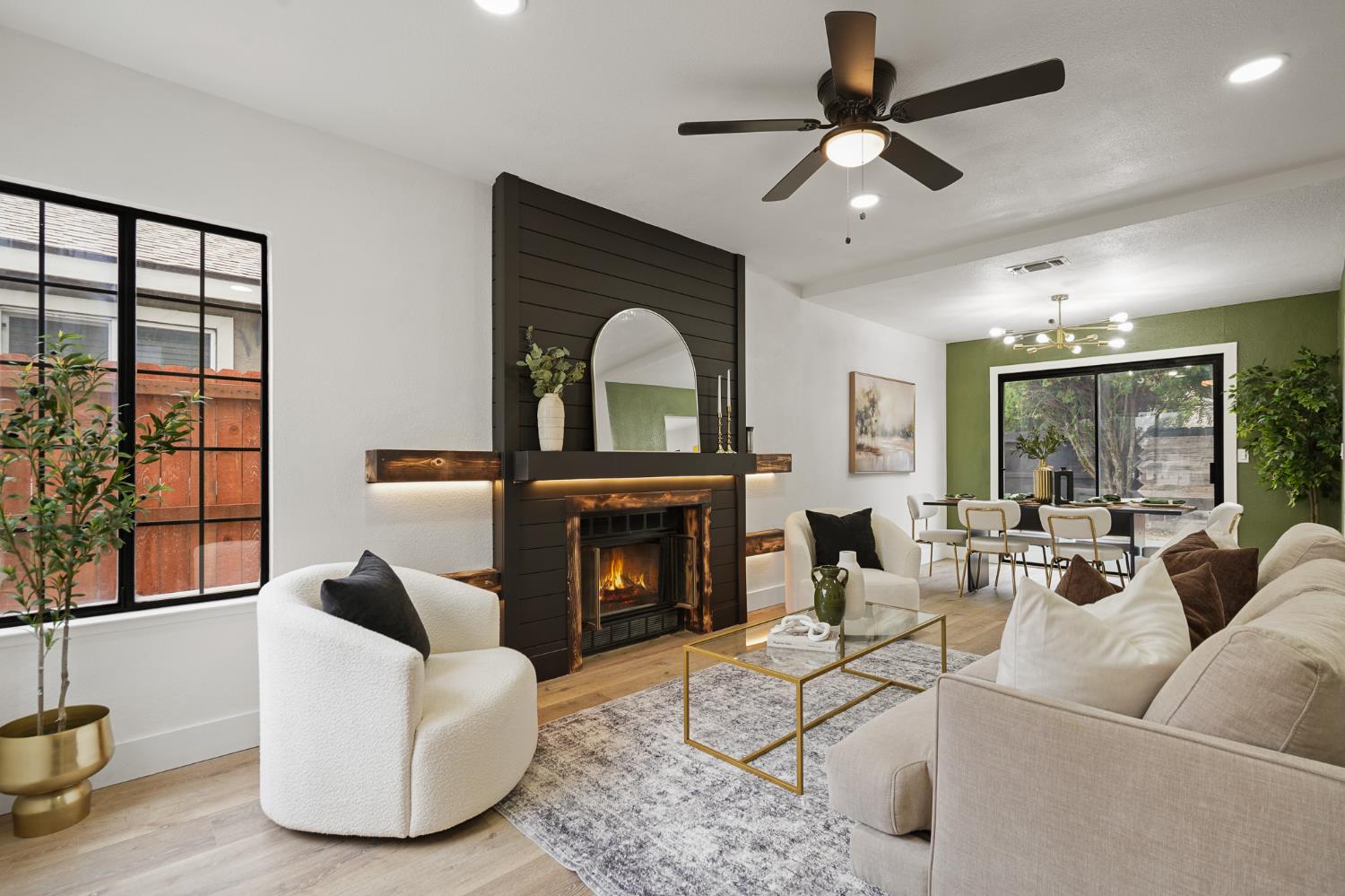 335 West Clover Road Tracy, CA 95376 - Photo 3 of 49 a living room with furniture a fireplace and a large window