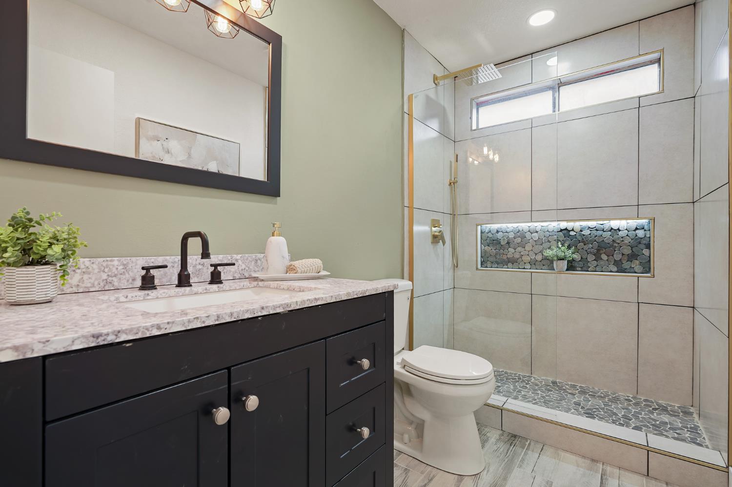 335 West Clover Road Tracy, CA 95376 - Photo 32 of 49 a bathroom with a granite countertop sink toilet and shower