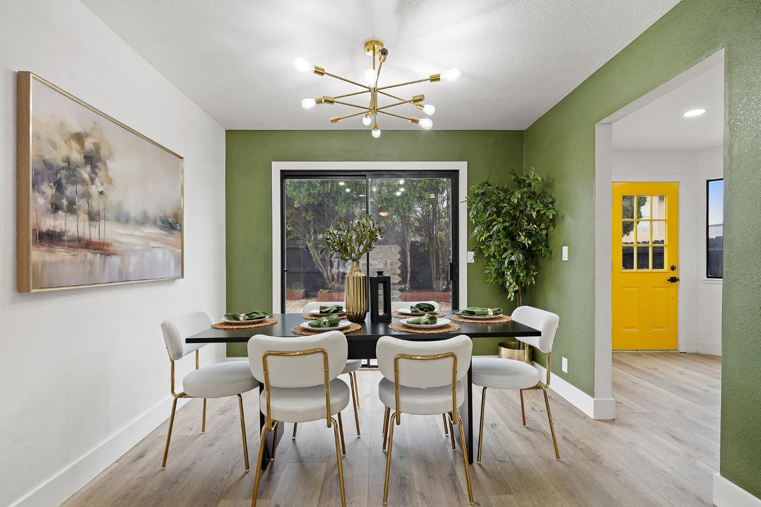 335 West Clover Road Tracy, CA 95376 - Photo 9 of 49 a dining room with wooden floor a chandelier a glass table and chairs