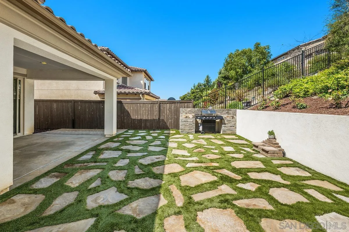 529 Adobe Estates Drive Vista, CA 92083 - Photo 15 of 39 a front view of a house with a garden