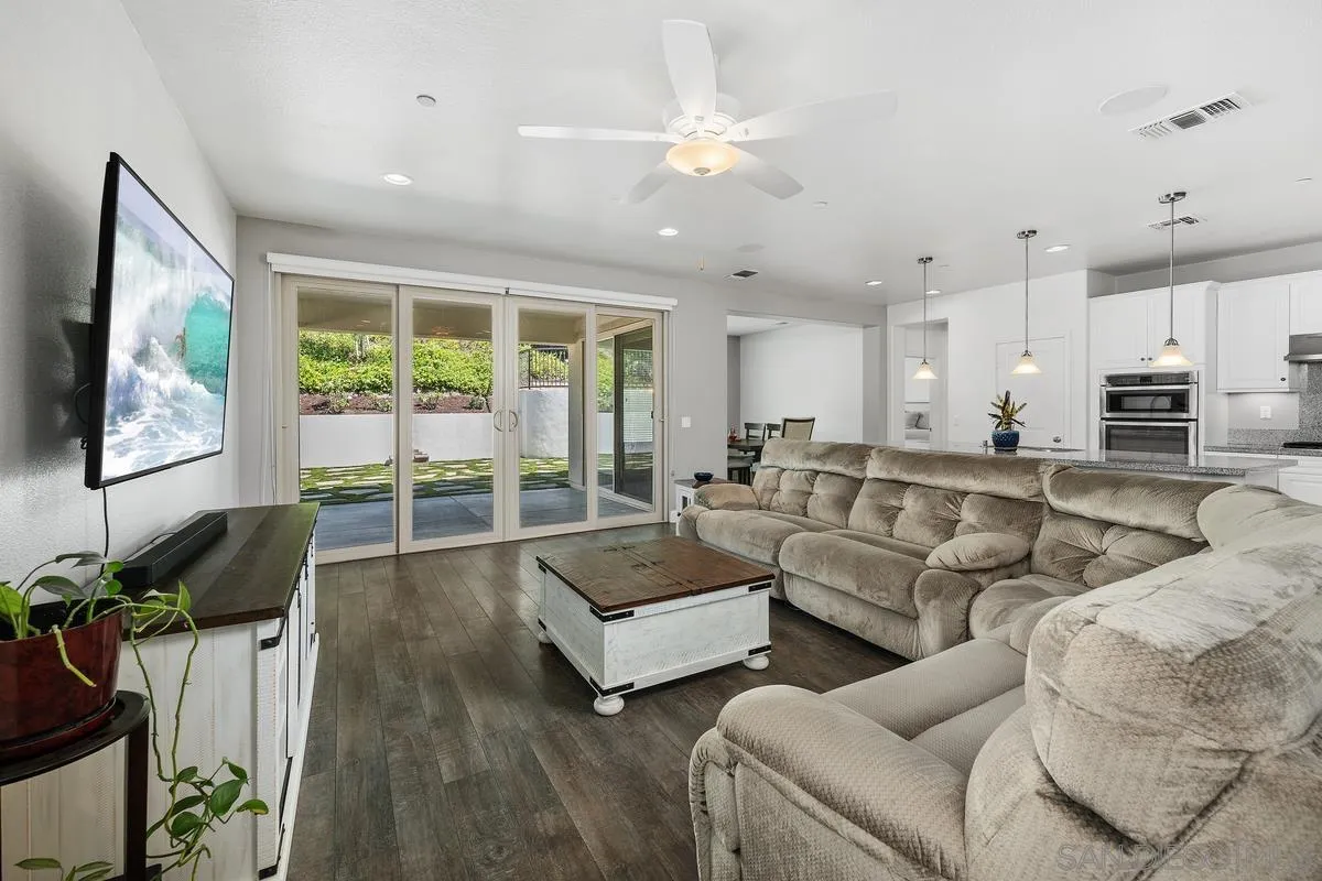 529 Adobe Estates Drive Vista, CA 92083 - Photo 2 of 39 a living room with furniture and a flat screen tv