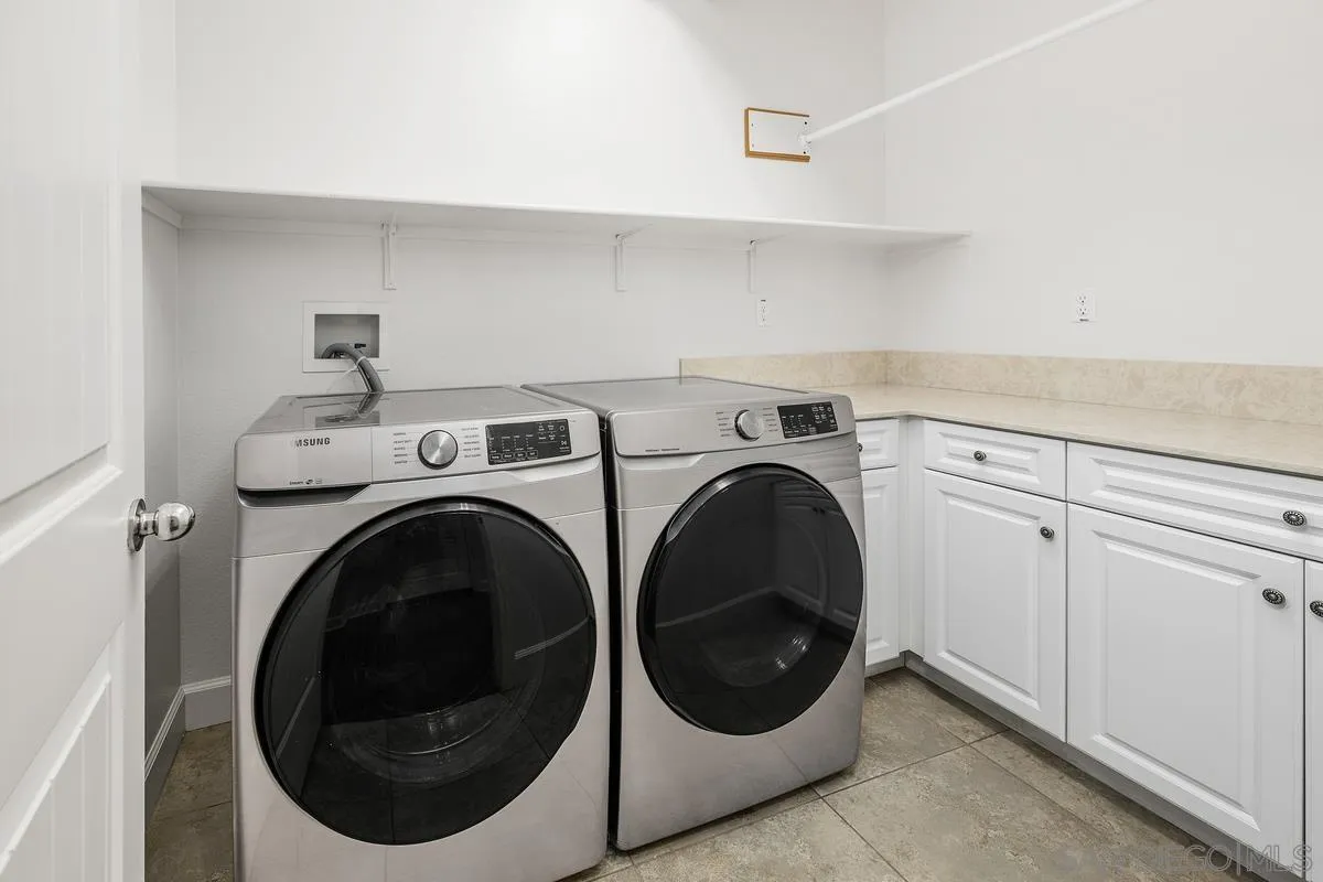 529 Adobe Estates Drive Vista, CA 92083 - Photo 22 of 39 a utility room with dryer and washer