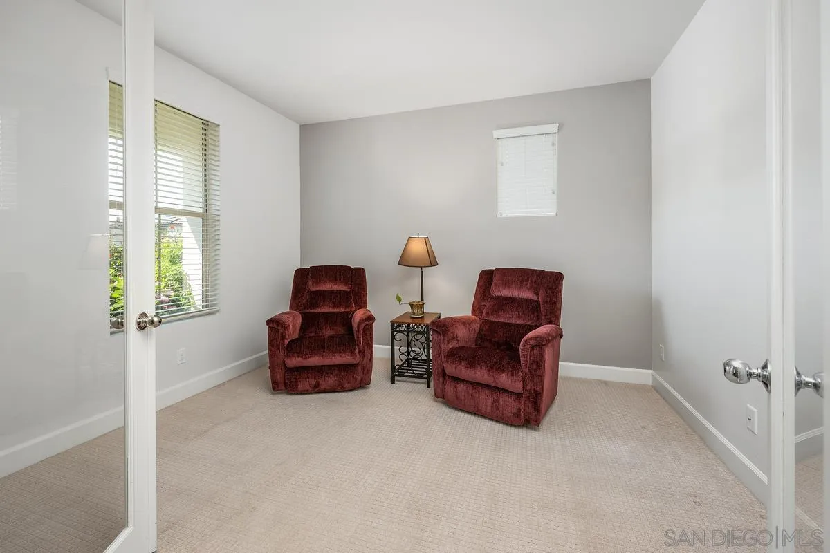 529 Adobe Estates Drive Vista, CA 92083 - Photo 23 of 39 a room with a couch and a dresser