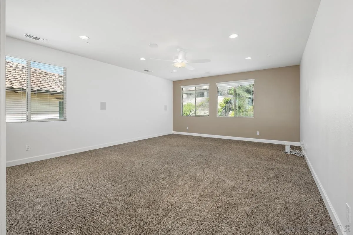 529 Adobe Estates Drive Vista, CA 92083 - Photo 26 of 39 an empty room with windows
