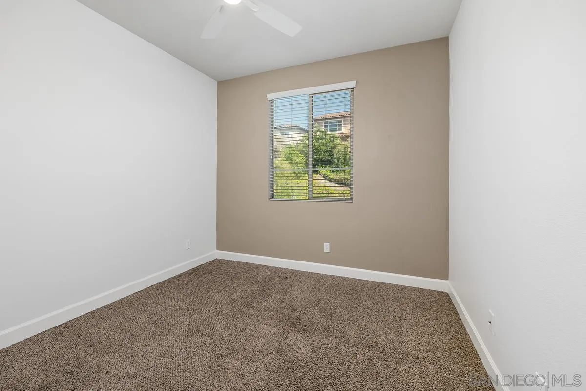 529 Adobe Estates Drive Vista, CA 92083 - Photo 31 of 39 an empty room with windows