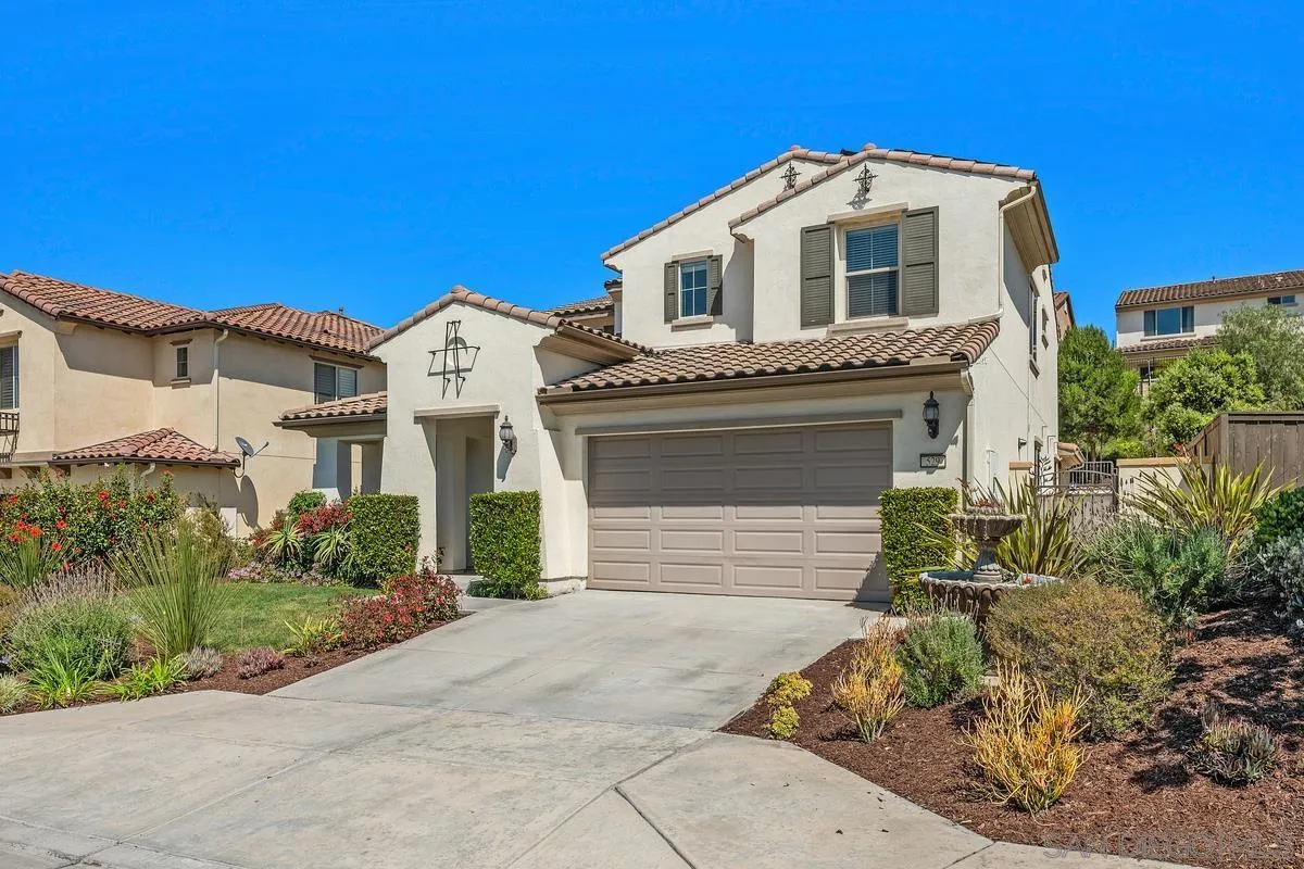 529 Adobe Estates Drive Vista, CA 92083 - Photo 35 of 39 a front view of a house with a yard