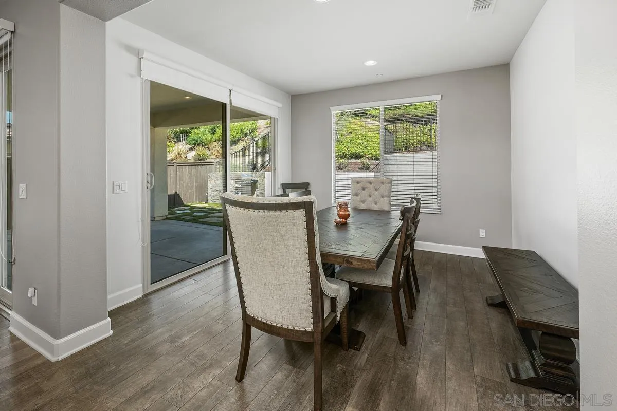 529 Adobe Estates Drive Vista, CA 92083 - Photo 8 of 39 a dining room with furniture and wooden floor