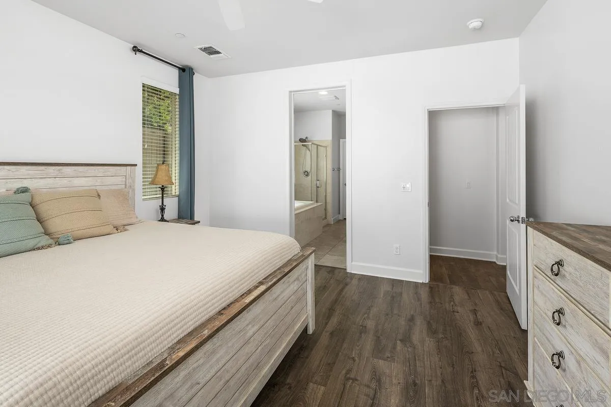 529 Adobe Estates Drive Vista, CA 92083 - Photo 10 of 39 a bedroom with a bed and a dresser