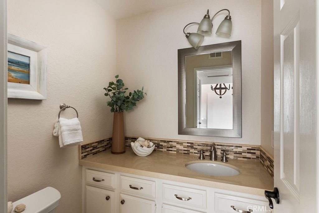 23274 Atlantis Way Dana Point, CA 92629 - Photo 29 of 53 a bathroom with a sink and a mirror