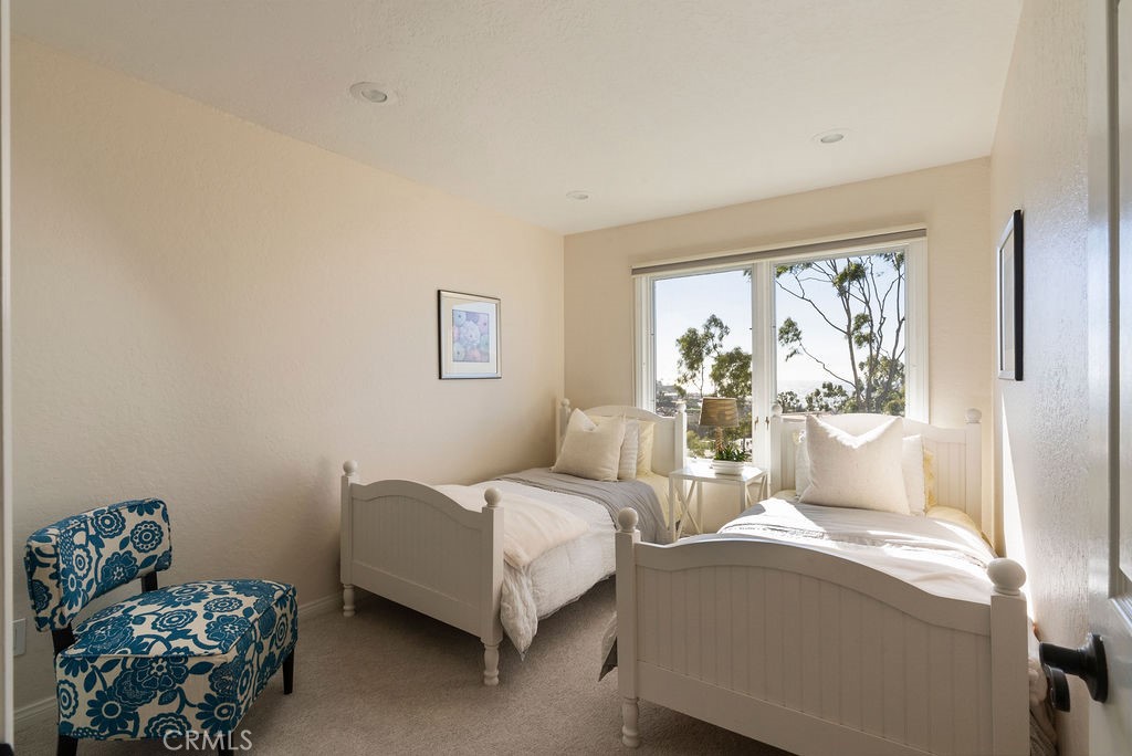 23274 Atlantis Way Dana Point, CA 92629 - Photo 30 of 53 a bedroom with a bed and a window