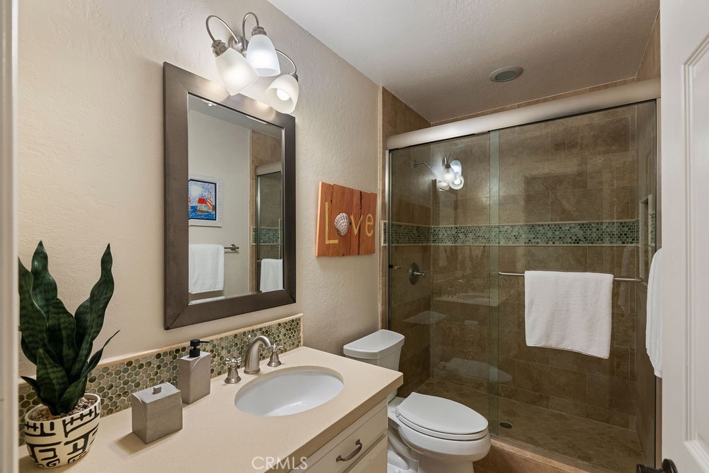 23274 Atlantis Way Dana Point, CA 92629 - Photo 31 of 53 a bathroom with a sink toilet and shower