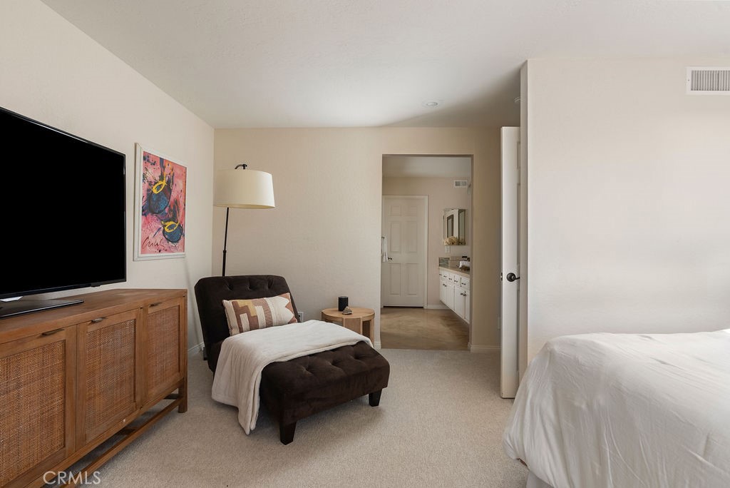 23274 Atlantis Way Dana Point, CA 92629 - Photo 35 of 53 a bedroom with a bed and a flat screen tv