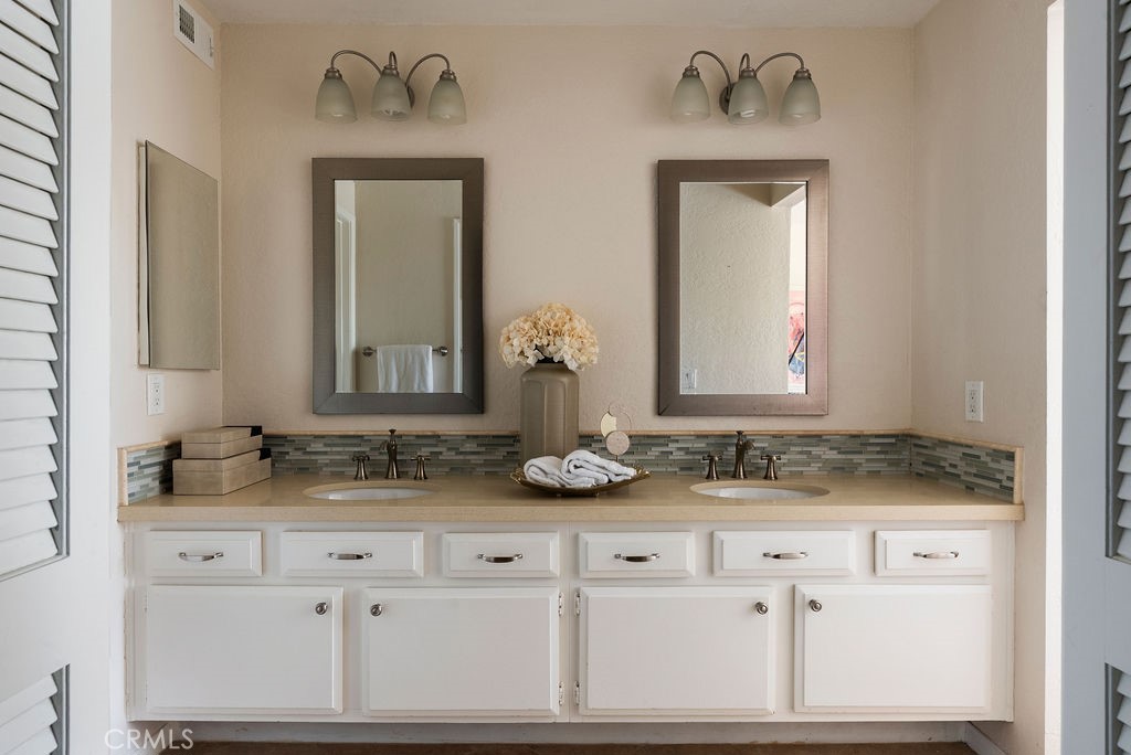 23274 Atlantis Way Dana Point, CA 92629 - Photo 35 of 53 a bathroom with sink and mirror