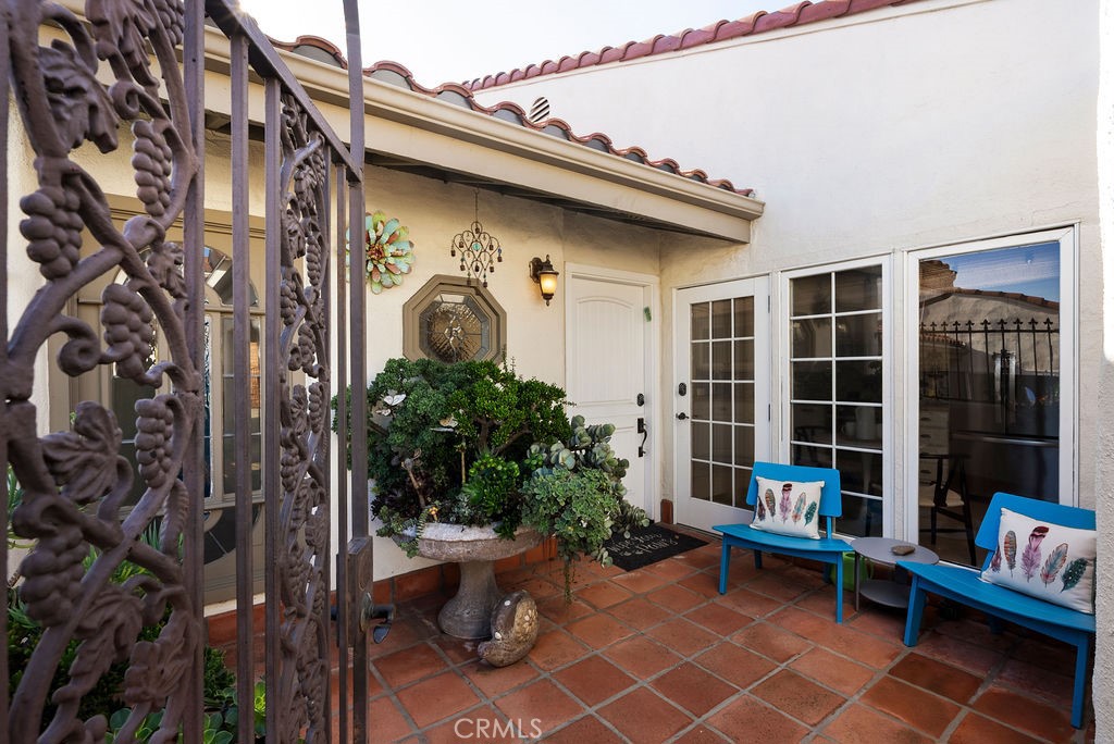 23274 Atlantis Way Dana Point, CA 92629 - Photo 7 of 53 a view of a patio with table and chairs and potted plants
