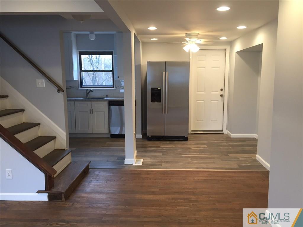 24 Sine Road Edison, NJ 08817 - Photo 6 of 11 a view of an empty room with stairs and ventilation