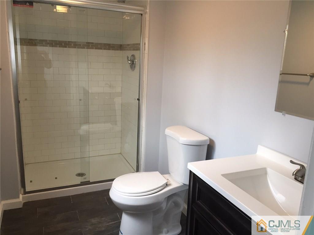 24 Sine Road Edison, NJ 08817 - Photo 10 of 11 a bathroom with a sink and a toilet