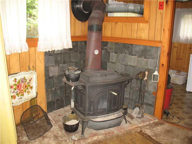 334 Black Point Road Beaver Cove, ME 04441 - Photo 16 of 25 Interior Space/Layout. Woodstove