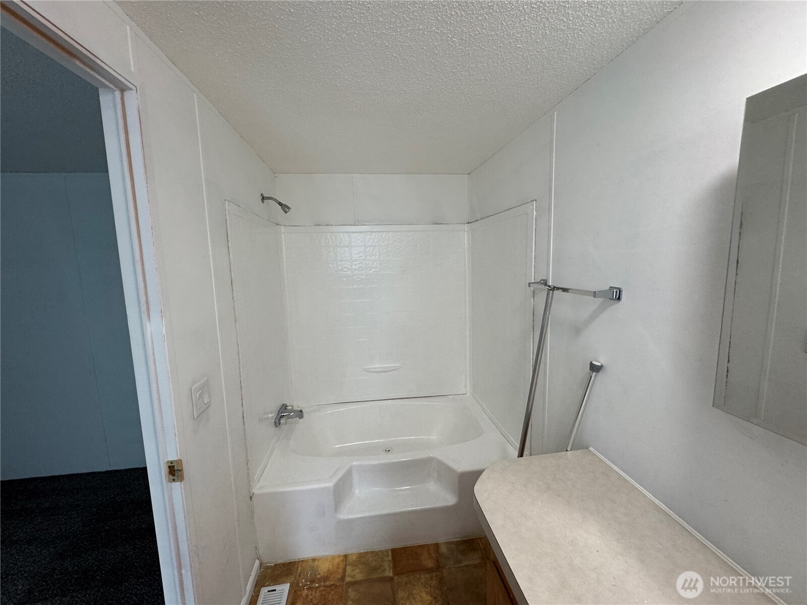 5705 Littlerock Road Southwest, Unit 30 Tumwater, WA 98512 - Photo 4 of 6 a bathroom with a tub and a shower