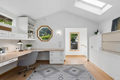 a bathroom with a toilet a sink and a mirror