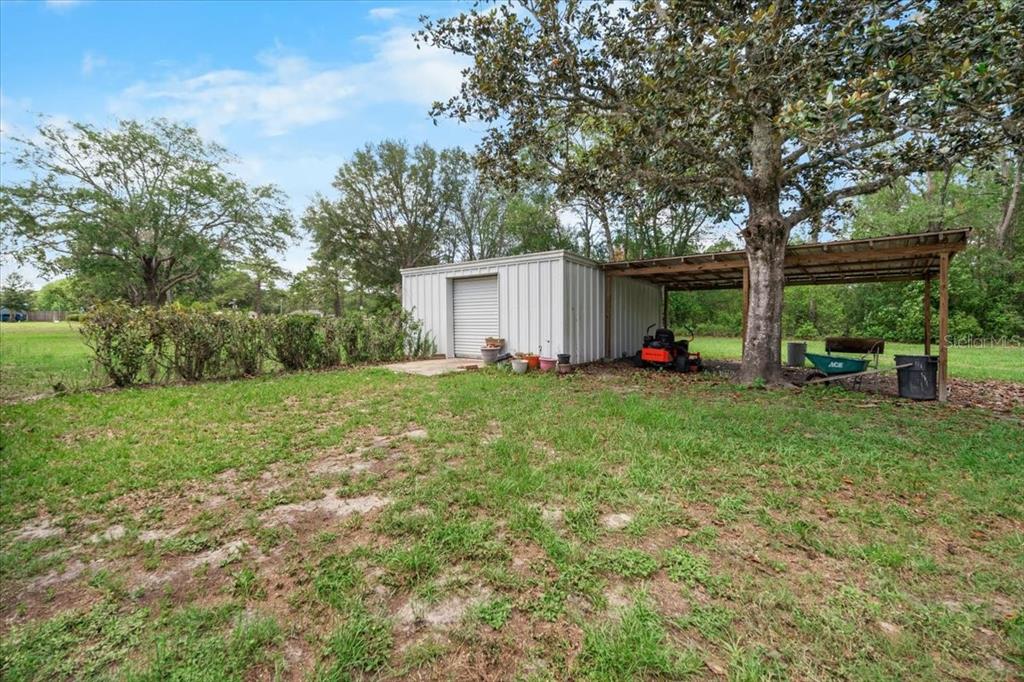7422 County Road 231 Lake Butler, FL 32054 - Photo 39 of 57 a view of backyard with green space and porch