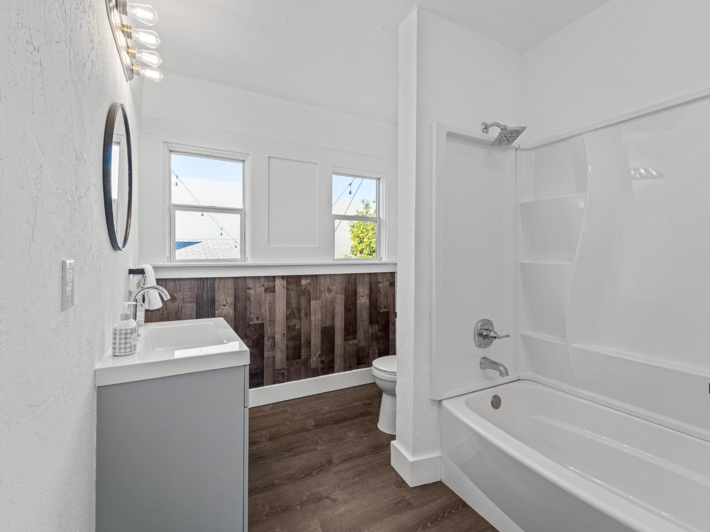 524 Fourth Street Rodeo, CA 94572 - Photo 24 of 36 a bathroom with a sink a toilet and shower