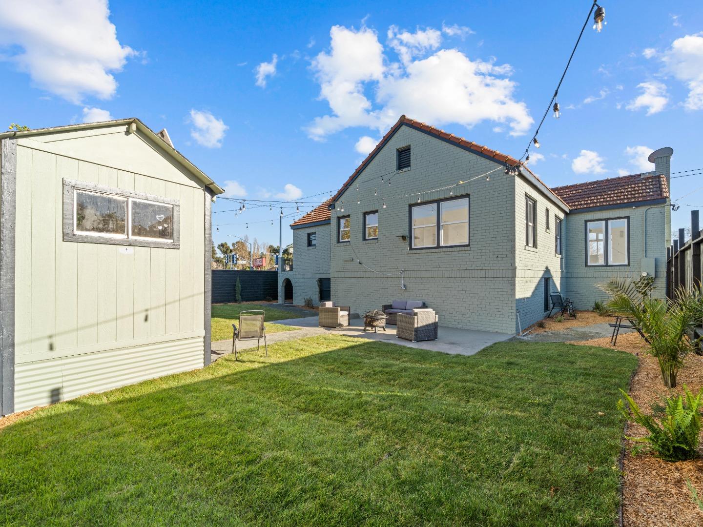 524 Fourth Street Rodeo, CA 94572 - Photo 33 of 36 a view of a house with a yard and sitting area