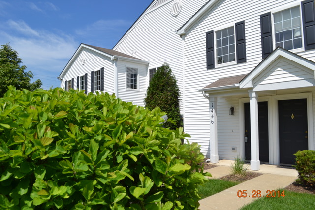 1446 McClure Road, Unit 1446 Aurora, IL 60505 - Photo 1 of 9 front view of a house with a yard