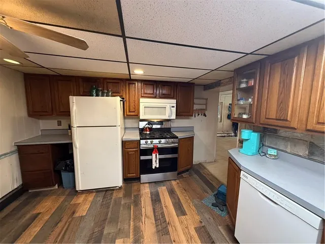 a kitchen with refrigerator a stove and a refrigerator